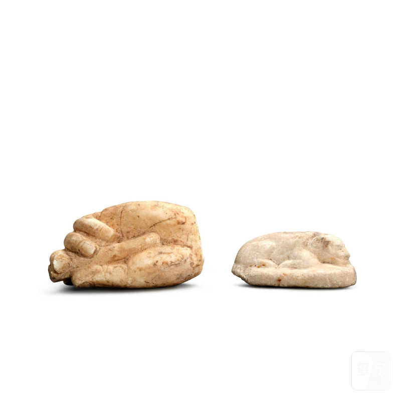 A marble lion and a marble torso of a hand, Tang dynasty | 唐 大理石雕獅子像及手部殘件